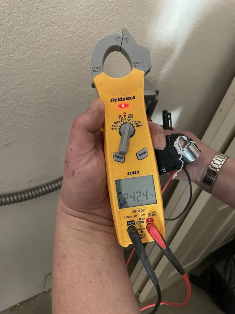 Voltage testing with clamp meter during Hot Tub / Pool Electrical Wiring in Atchison